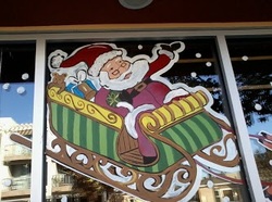 happy holiday christmas window painting of santa in san diego 